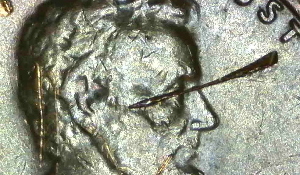 1982-Penny-Marks-On-Rim-And-Others-Damage?