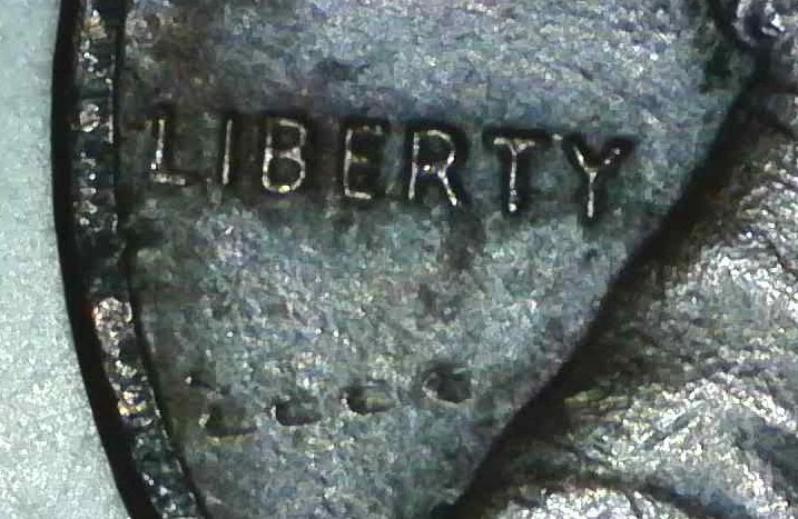 1985-Penny-Item-Under-Liberty-And-Partial-T-In-Trust