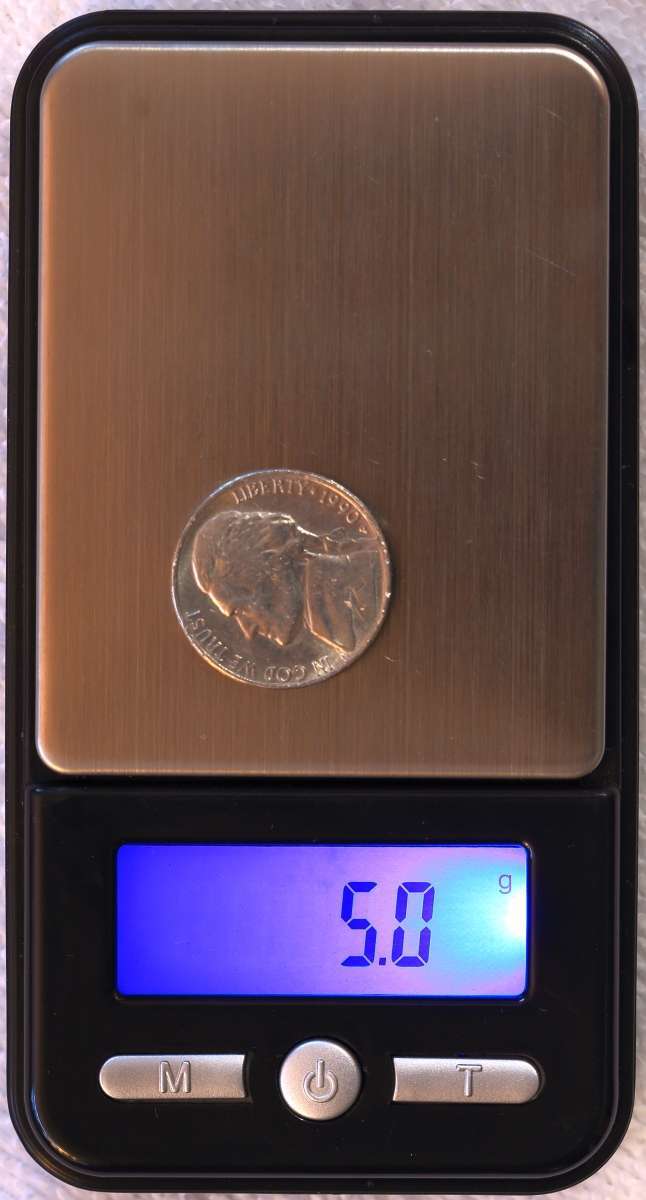 An-Authentic,-Genuine-And-Counterfeit-Henning-Nickel.