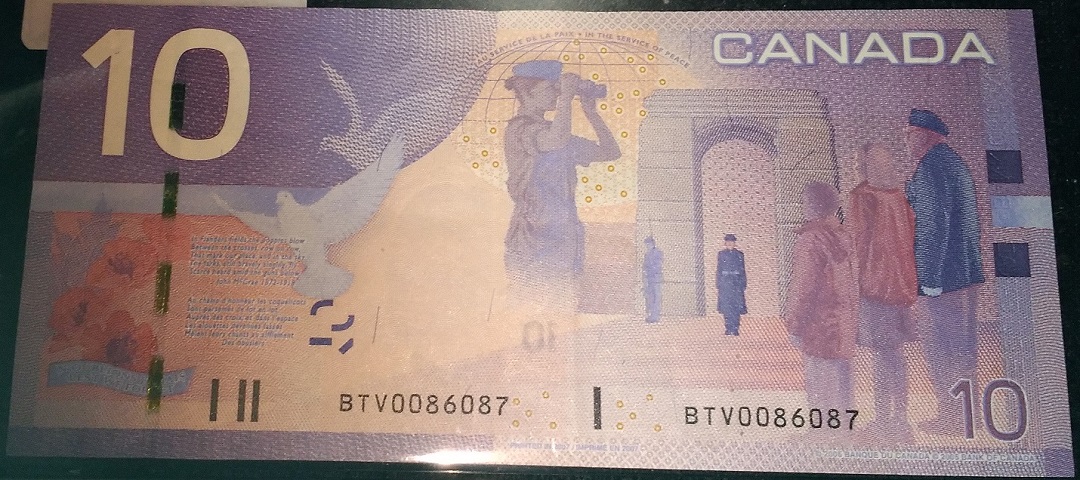 1954-Canadian-One-Dollar-Notes-With-Mismatched-Serial-Numbers