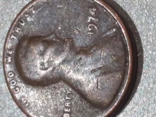 1974-Penny-Struck-Through-Grease-Or-Wear-And-Tear-Damage?