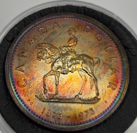 Spectacular-Toning-And-Date-Doubling-1973-RCMP-Dollar