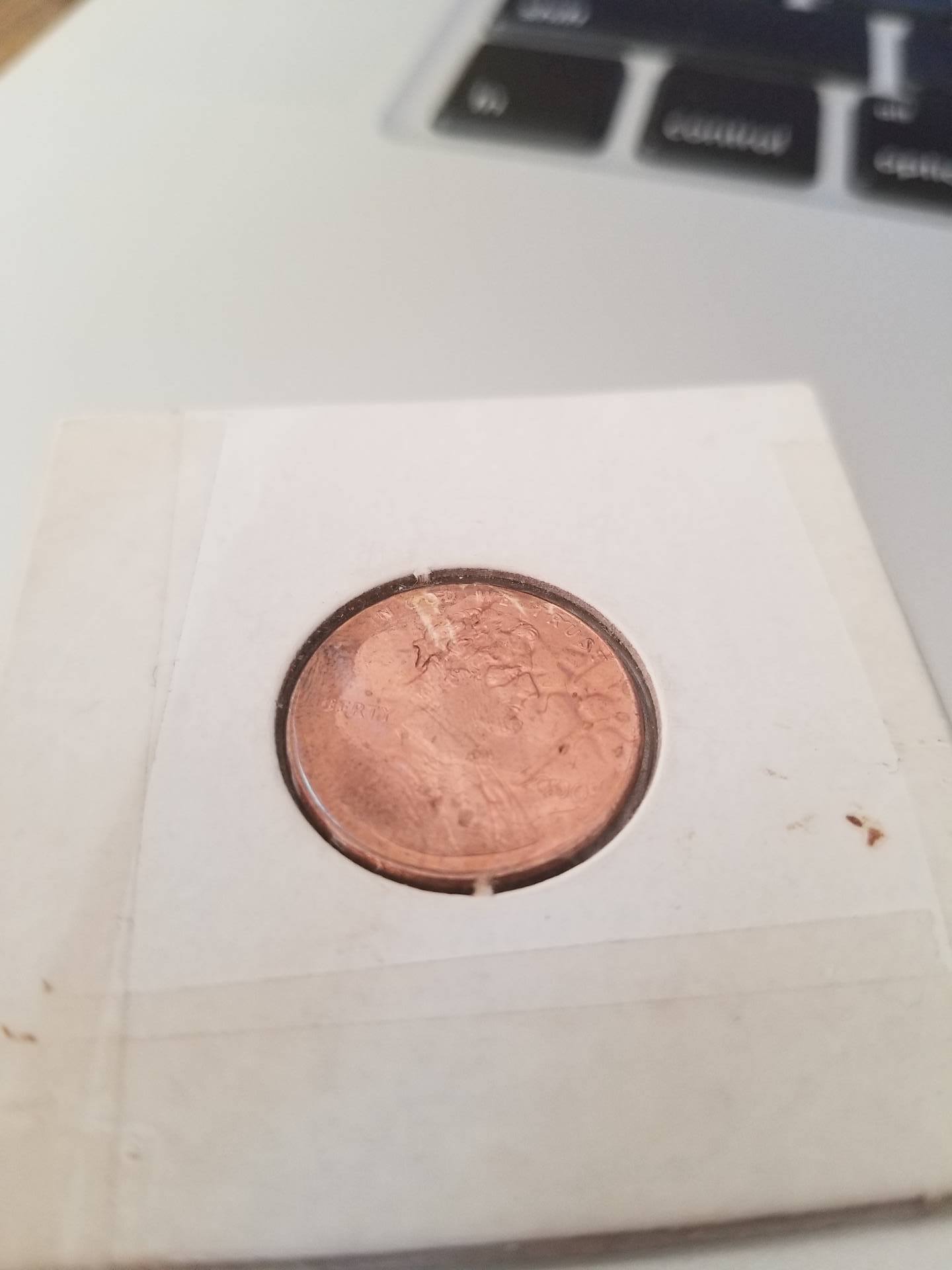 Weird-Penny-Markings-2000-Blank-Mint-Mark-Like-An-Antler-Or-Lightning?