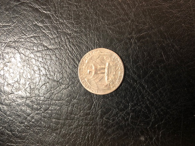1965-US-Quarter-With-Letters-Very-Close-To-Top-Of-Coin