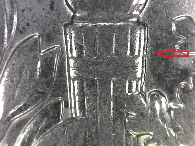 2000-D-Dime-With-Something-Extra-In-The-Torch-Band.