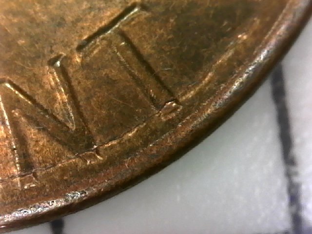 1984-D-Lincoln-Penny-With-Semi-Circular-Crack-In-Reverse.