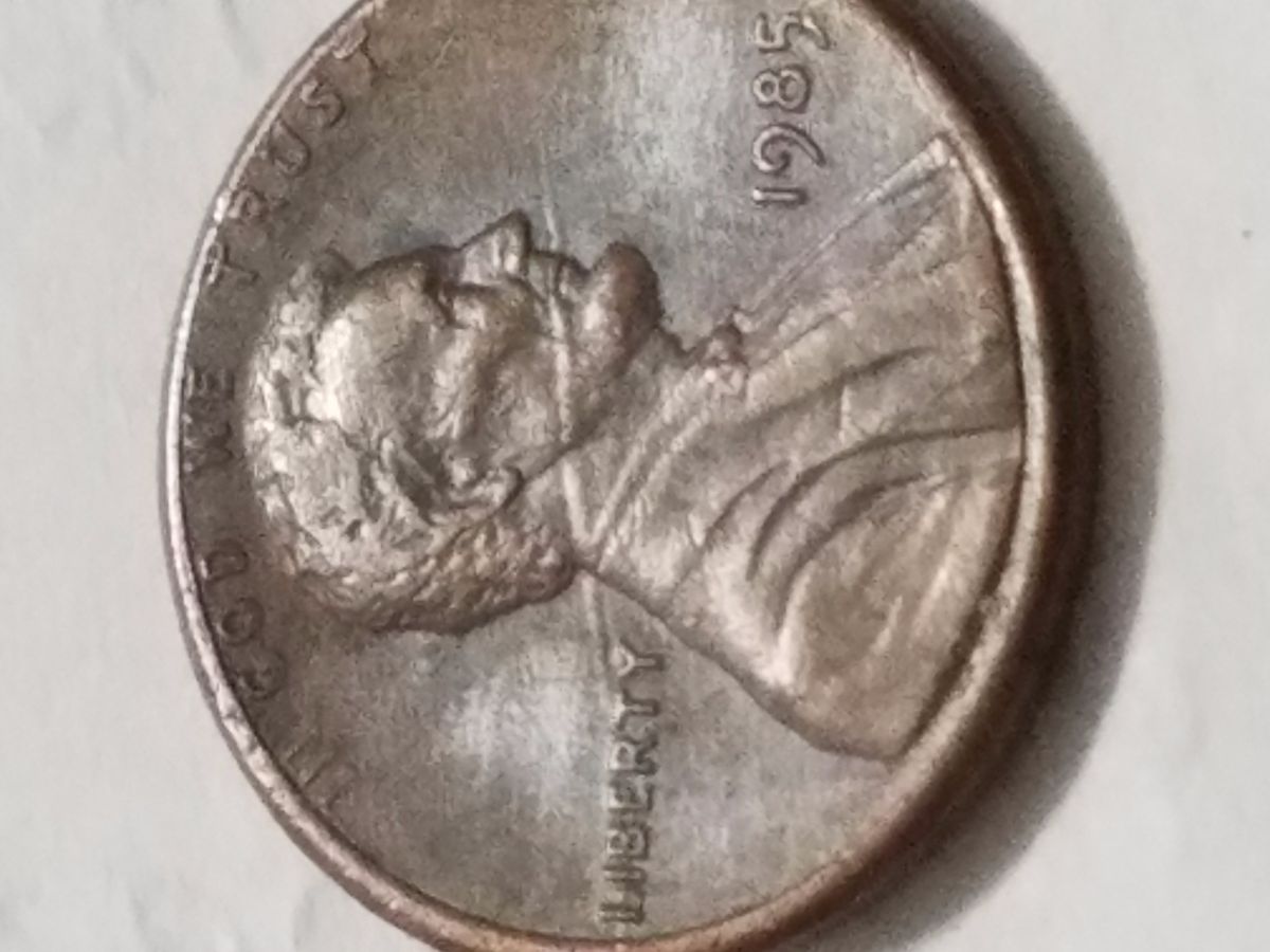 1985-Lincoln-Penny-Speared-From-Neck-Trough-Mout.