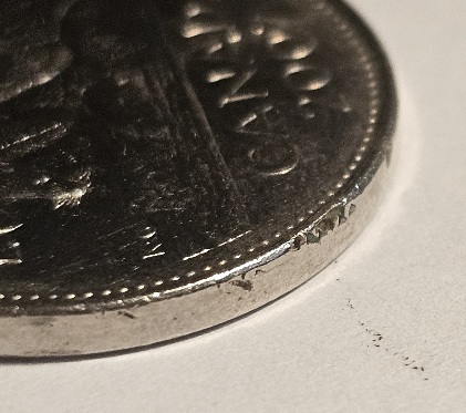 2007-Nickel-Struck-Through-Retained-Resin/Plastic?