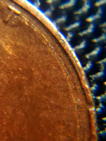 1987-Penny-With-Melted-Dot-Next-To-7.