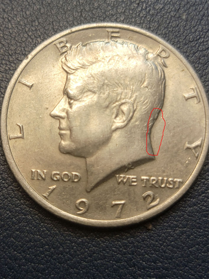 1972--Kennedy-Half-Dollar.---Doubling-In-The-Back-Side-Of-Head.