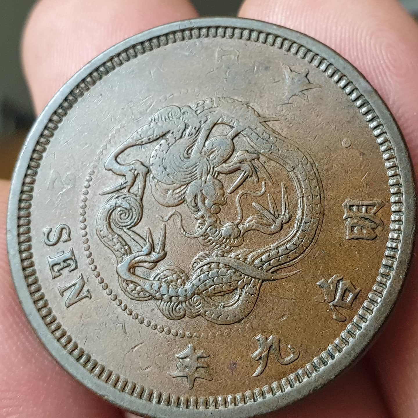 Japan-1876-2-Sen-Struck-Thru-A-Whole-Lot-Of-Something