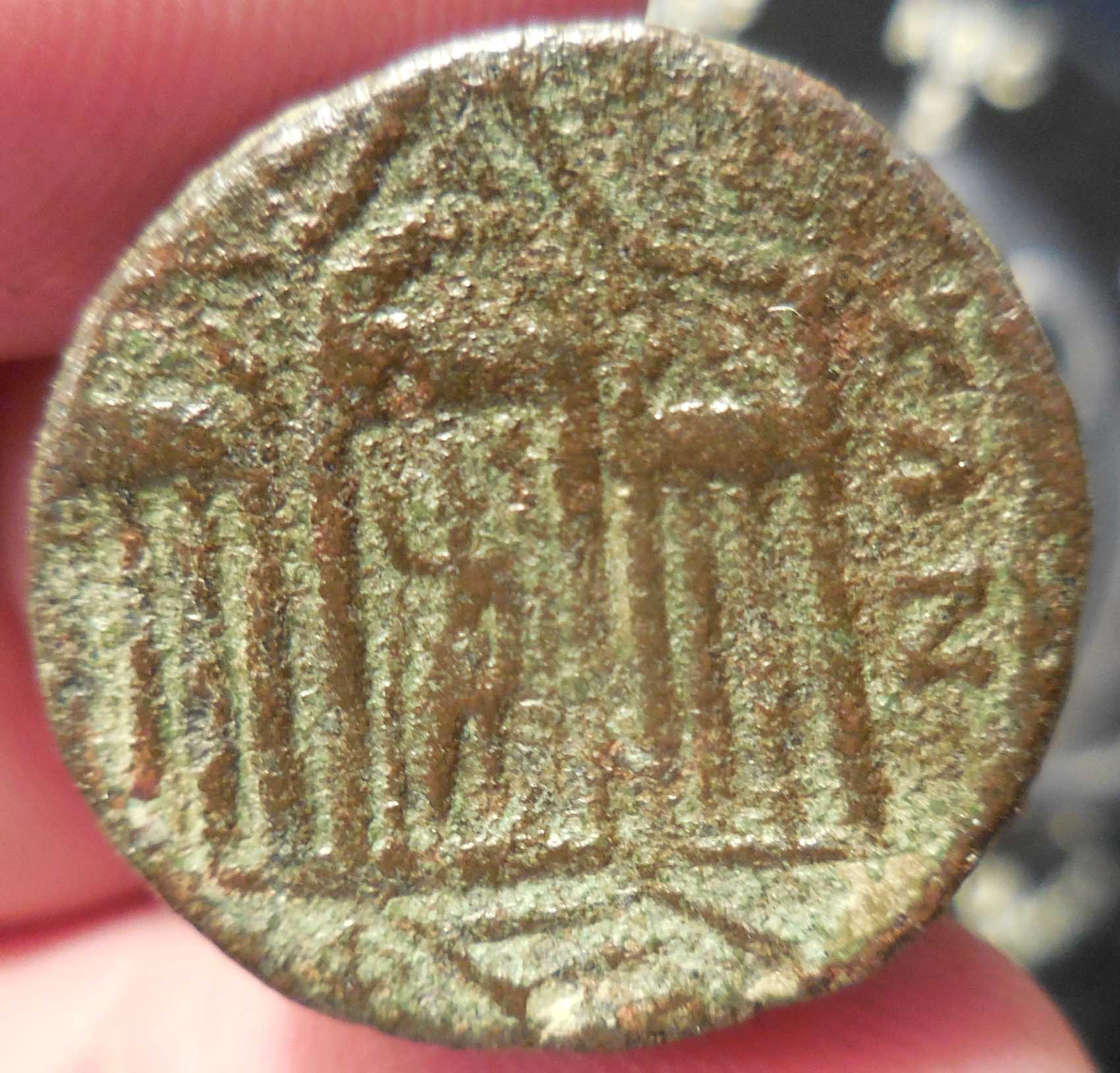 Odd-Question-Raised-From-Raised-Hand-On-Statues-On-Coins:
