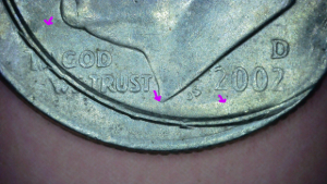 2002-D-Dime--&-Double-Rim-Across-Face-&-Second-Ear-Left-Side-Of-Face