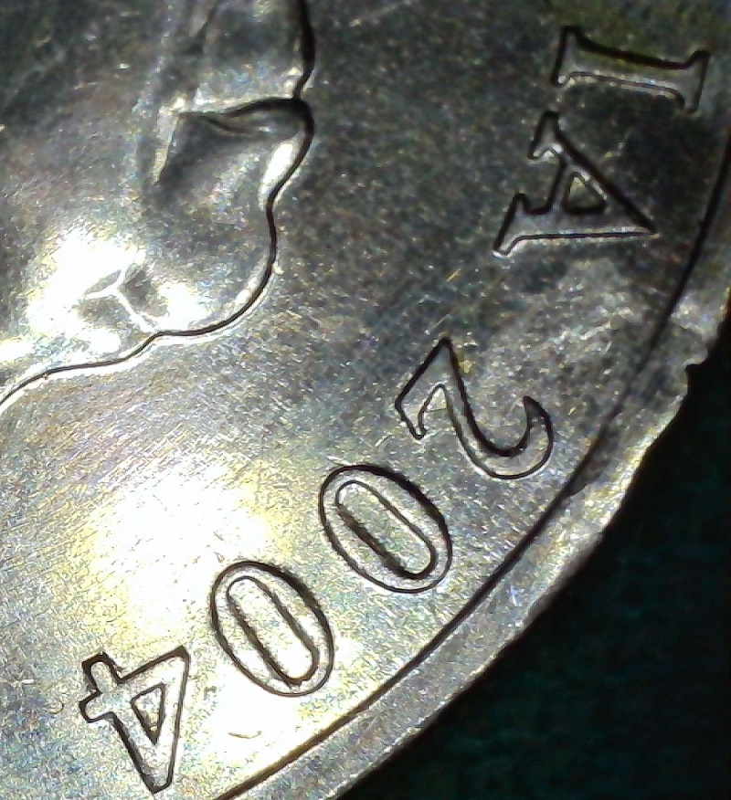 What-Was-This-Coin-With-A-Bite-Out-Of-The-Rim-Doing-In-A-Mint-Set?-2004-