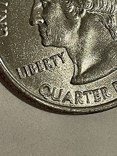 2002--P-Louisiana-State-Quarter-Error?-Letters-Q-&-U,-T-&-E-Touching