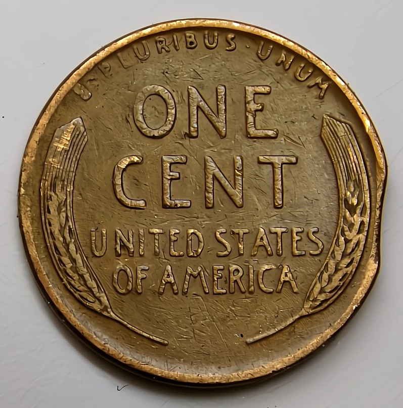 1945-Lincoln-Cent-Struck-On-A-Clipped-Planchet