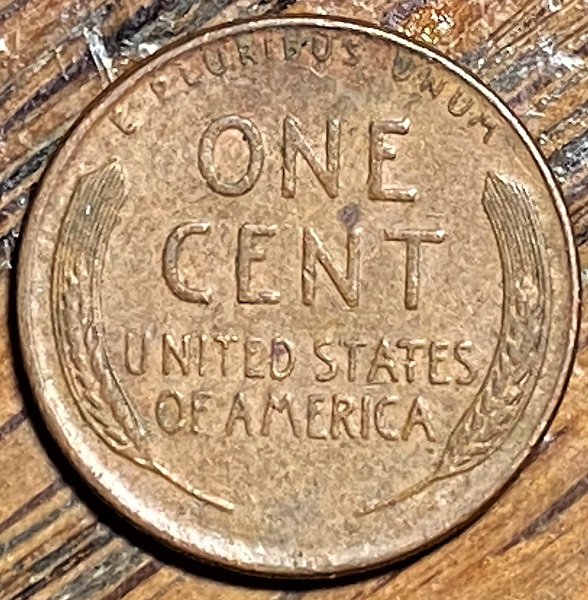 1957-D-Lincoln-Penny-With-Lamination-Through-His-Neck