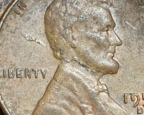 1957-D-Lincoln-Penny-With-Lamination-Through-His-Neck