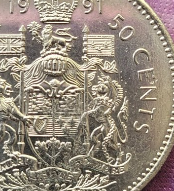 Need-Help-Identifying-This-Error.-Struck-Through?-Flawed-Planchet?-Missing-S-On-1991-50-Cent