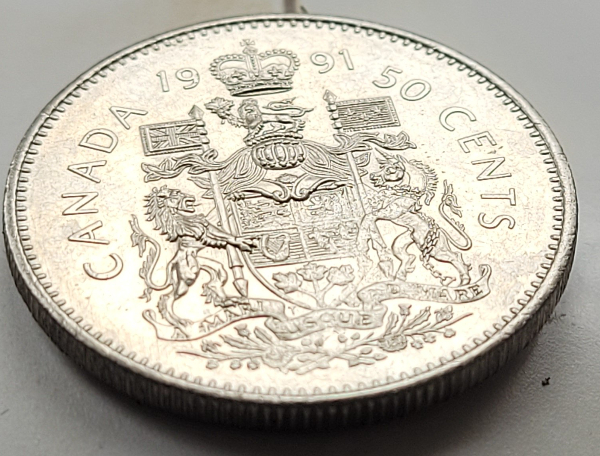 Need-Help-Identifying-This-Error.-Struck-Through?-Flawed-Planchet?-Missing-S-On-1991-50-Cent