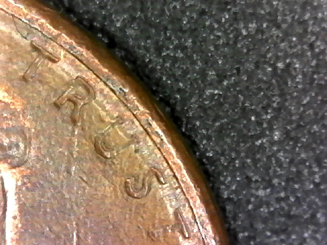 1987-D-Penny-RPM-&-Parallel-Lines-Running-Around-Half-Of-Edge-Of-Coin