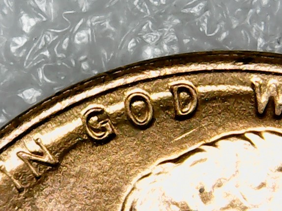 Penny-With-Raised-Half-Circle-Going-Thru-In-God-We-Trust