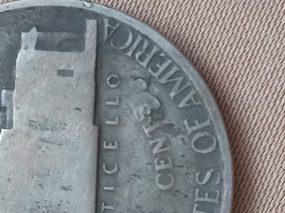 1943-S-Nickel-With-Copper-Streak-In-Front-And-Upside-Down-S-On-Cents-On-Top