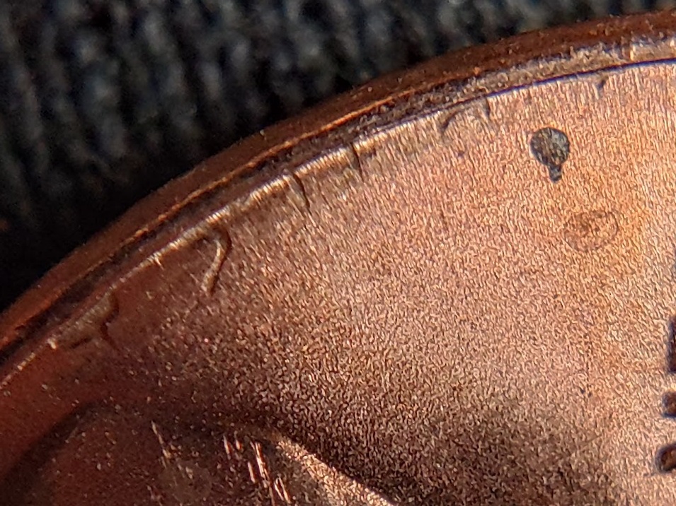 1983-P-Lincoln-Cent-With-A-Secondary,-Incuse-&-Inverted,-Trust-In-The-Corner-Of-The-Rim-And-Field.