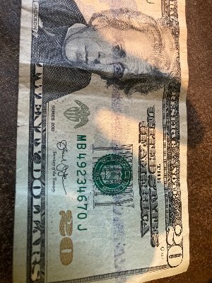 2013-20-Dollar-With-Wierd-Blue-Stripe-Across-Face?
