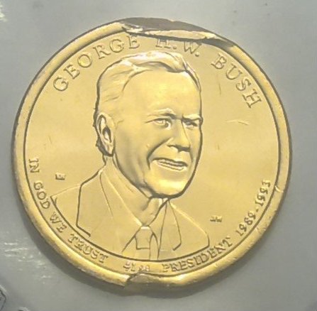 George-H.-W.-Bush-Dollar-Coin-With-Die-Damage
