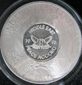 1923-P-Peace-Dollar-With-1993-Peace-Accord-Over-Stamp-On-Reverse