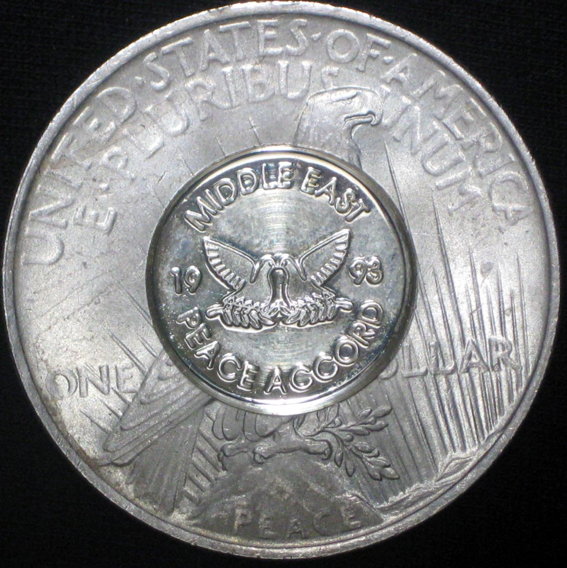 1923-P-Peace-Dollar-With-1993-Peace-Accord-Over-Stamp-On-Reverse