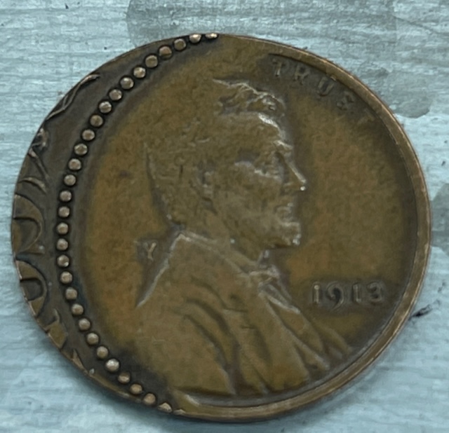 1913-Penny-Error-Or-Manipulation--Off-Center-Strike-With-Script-On-The-Planchet