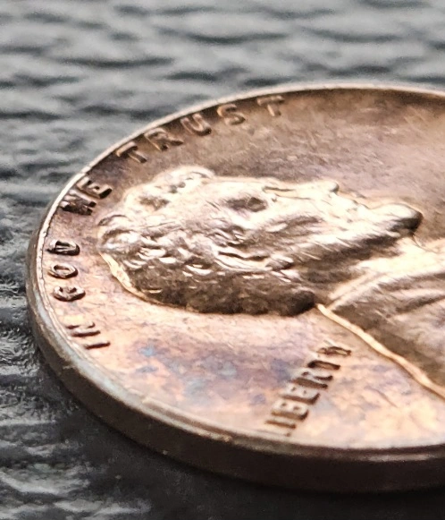 1964-D-Penny-Obverse-In-God-We-Trust-Rolled-Up-On-Rim-Halfway