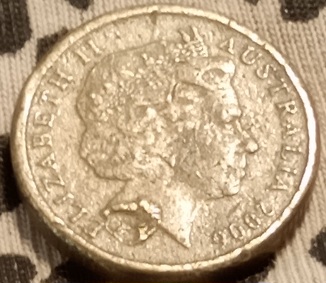 2006-$2-Coin-With-'Blobs'-Of-Metal