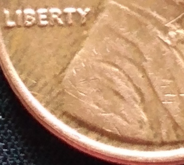 1976-D-Penny-Error-In-Background