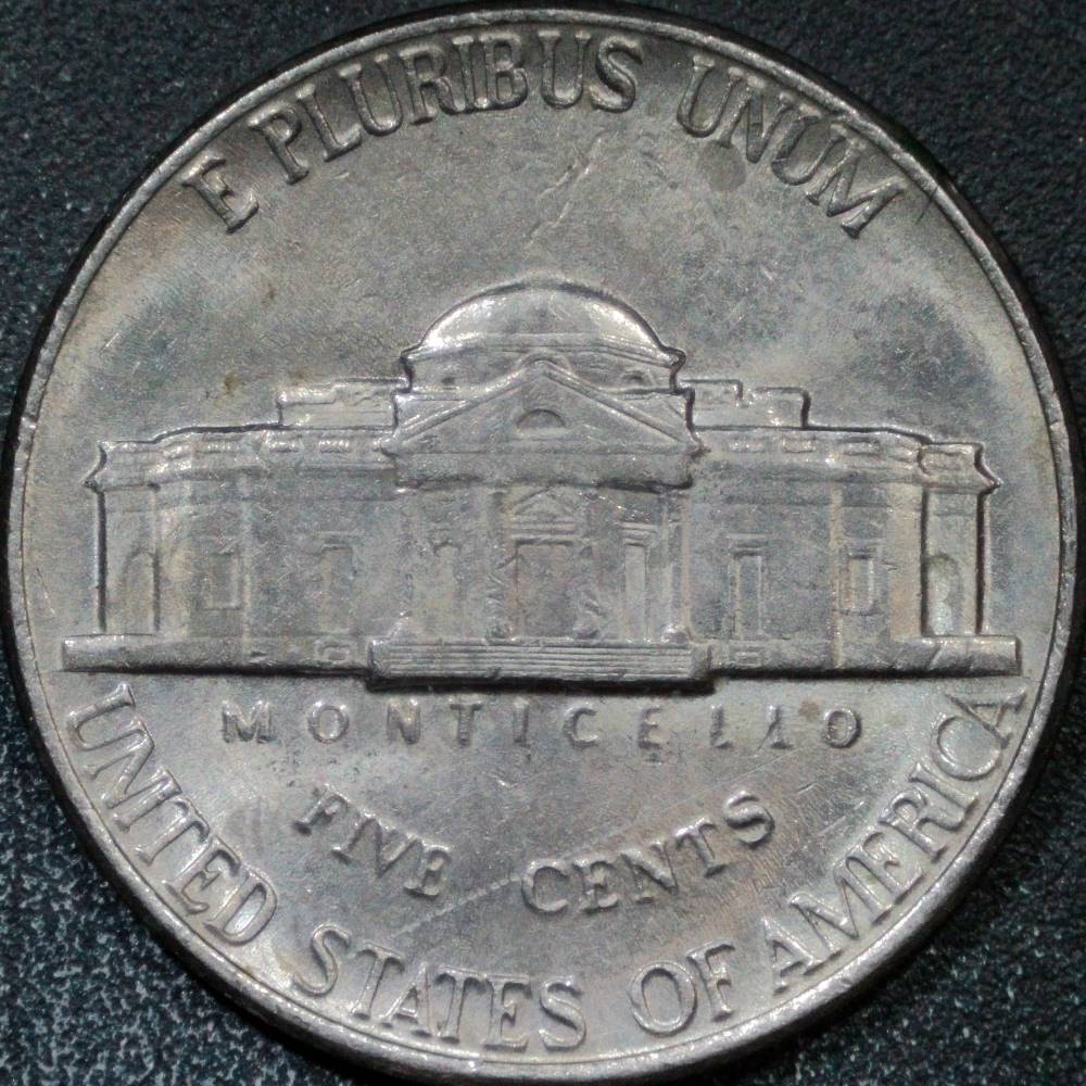 1995-P-Nickel-With-Indent:-Struck-Through-Or-PMD?