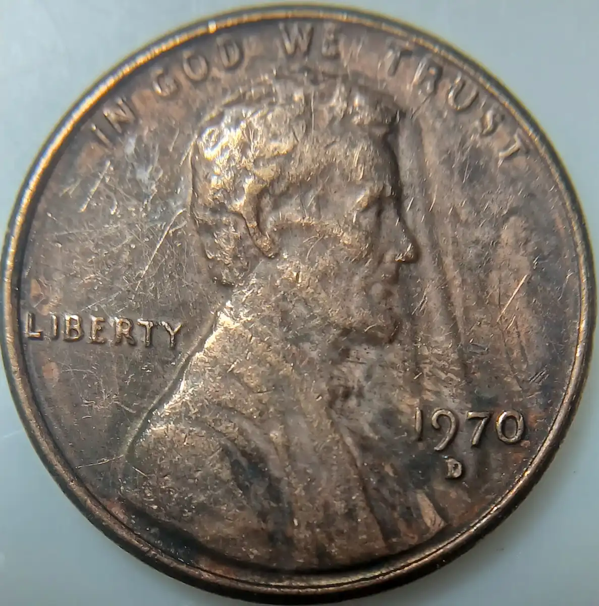 1970-Lincoln-Penny-With-Unknown-Design-In-Front-Of-The-Portrait.