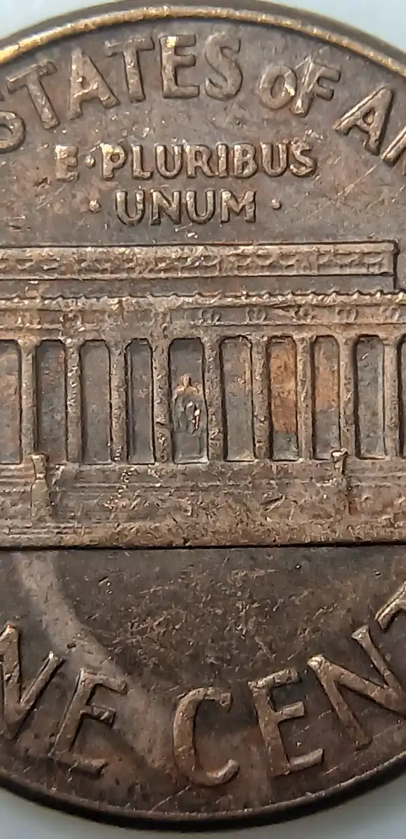 1970-Lincoln-Penny-With-Unknown-Design-In-Front-Of-The-Portrait.
