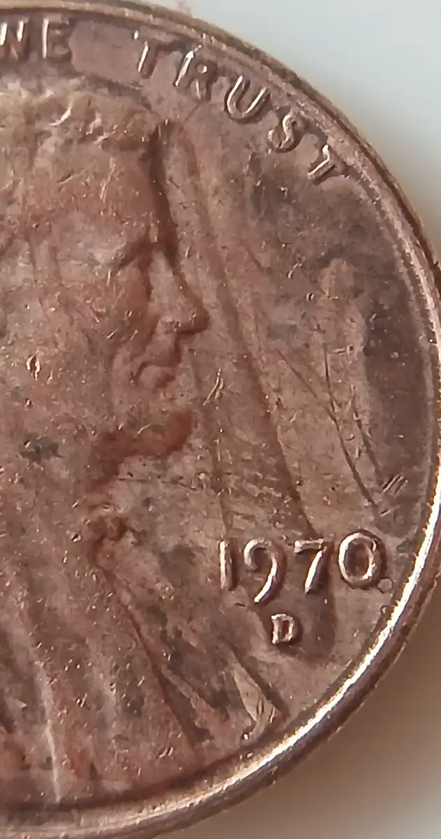 1970-Lincoln-Penny-With-Unknown-Design-In-Front-Of-The-Portrait.