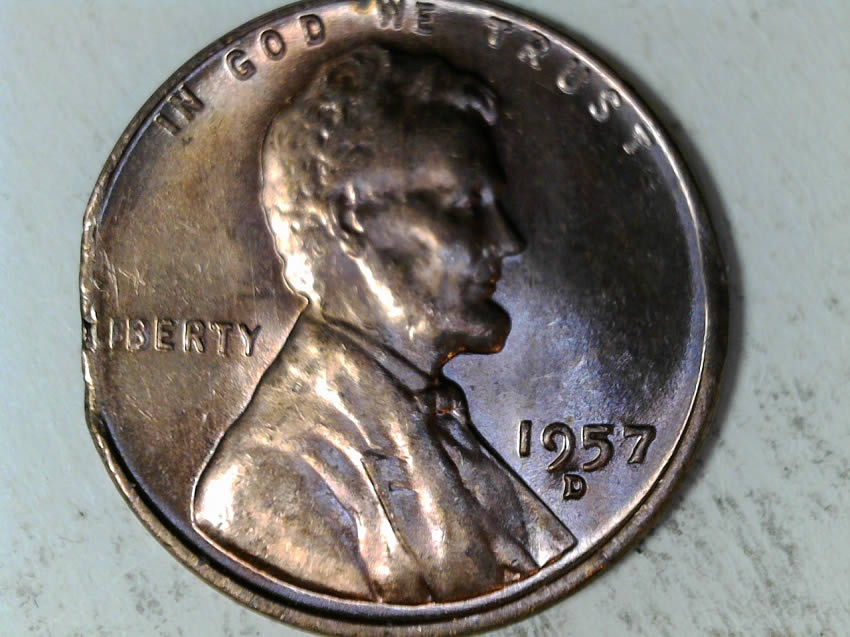 1957-D-Cent-Clipped-Planchet-With-Blakesly-Effect
