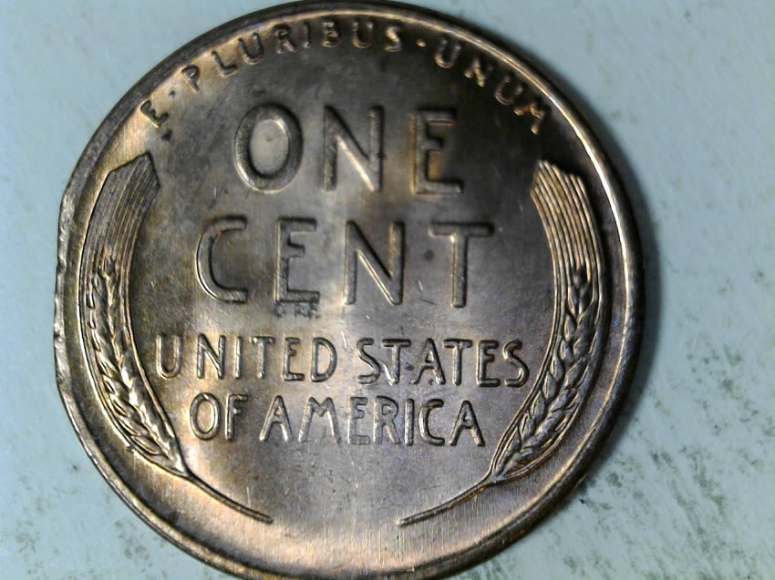 1957-D-Cent-Clipped-Planchet-With-Blakesly-Effect