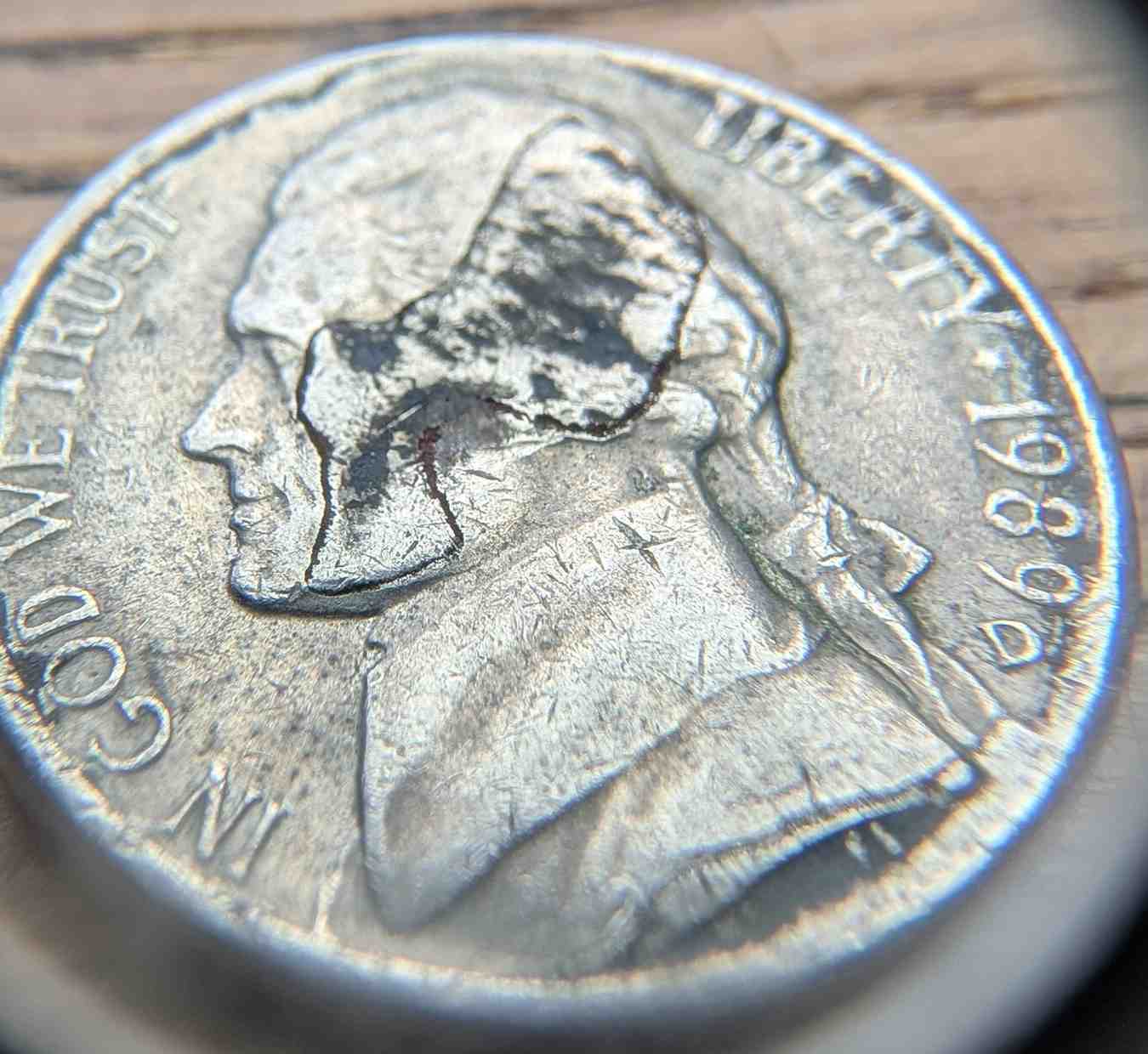 Jefferson-Nickel-Struck-In-Metal-Fragment