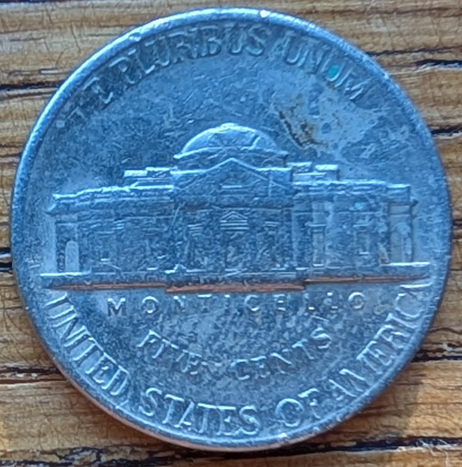 Jefferson-Nickel-Struck-In-Metal-Fragment