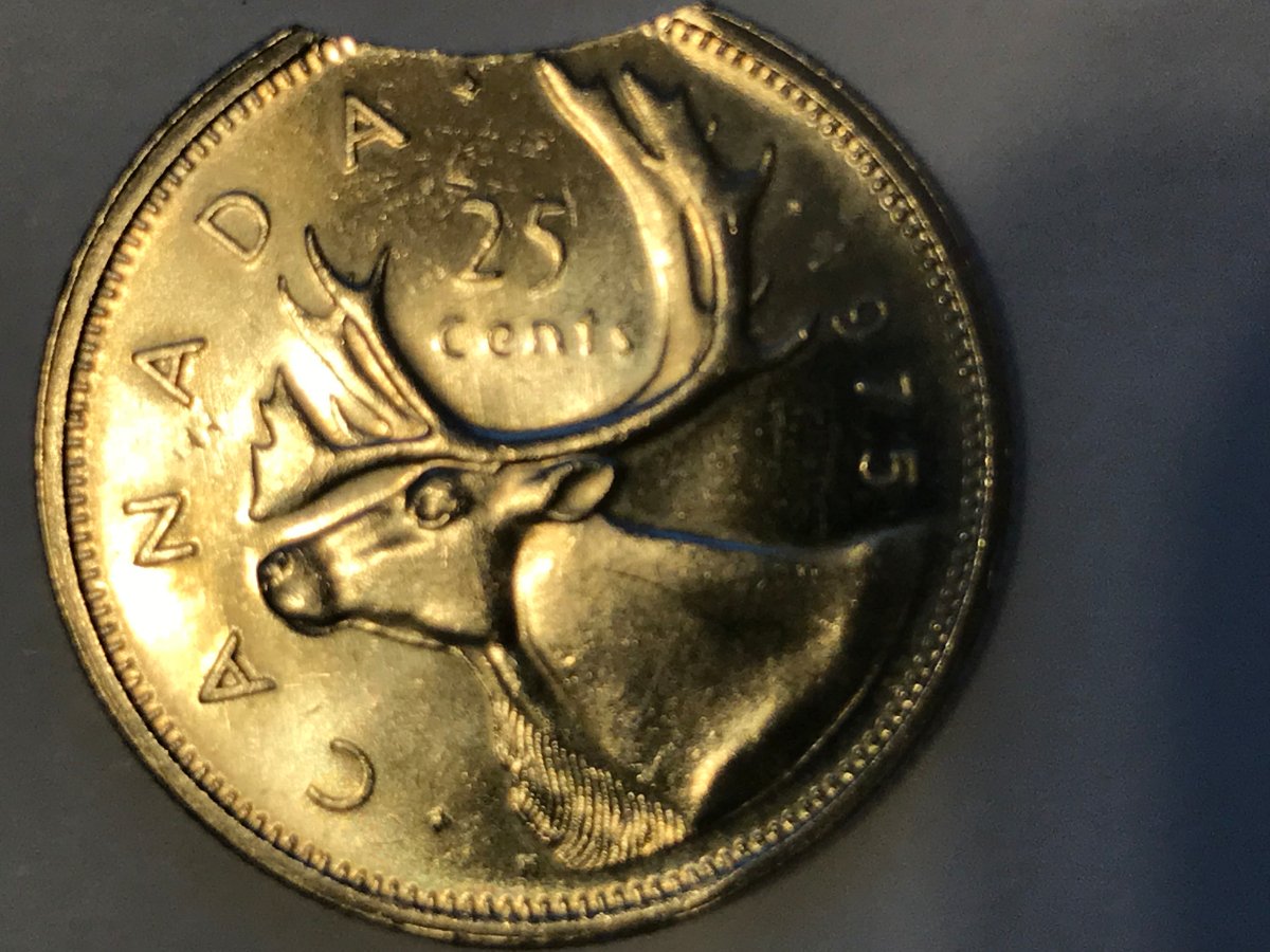 1975-25-Cents-Clipped-Planchet---Specimen-Strike