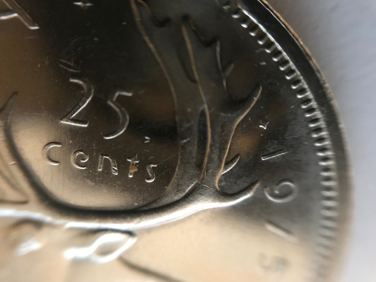 1975-25-Cents-Clipped-Planchet---Specimen-Strike