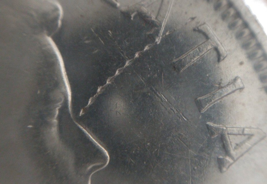 1955-Silver-Dollar-Struck-Through-Wire-On-Obverse-Close-Up-Pictures