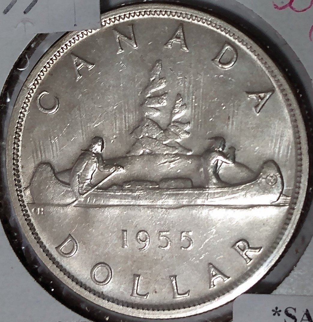 1955-Silver-Dollar-Struck-Through-Wire-On-Obverse-Close-Up-Pictures