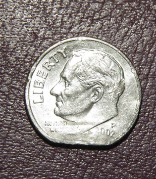 Looking-To-See-If-This-Is-An-Error,-Or-Just-Someone-Clipping-A-Coin.-2002-Dime