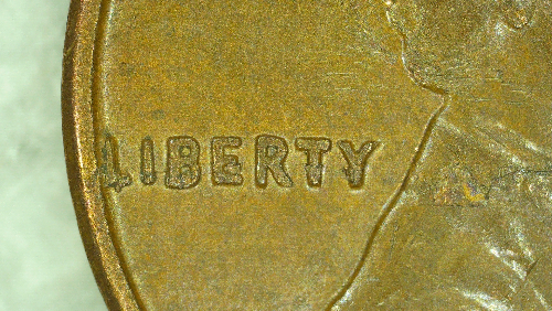 1962-D-Lamination-On-Obverse-Through-Liberty
